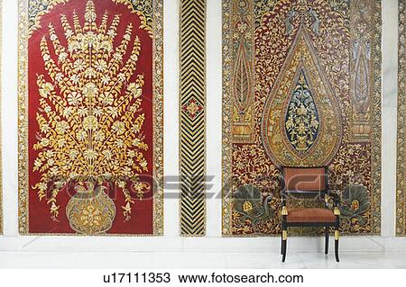 Stock Image - Armchair in front of a wall. Fotosearch