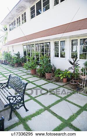 Bench in front of a house View Large Photo Image Stock Photography - Bench in front of a house. Fotosearch