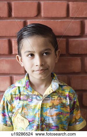 Picture - Close-up of a boy looking away. Fotosearch