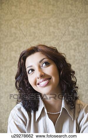 Close-up of a businesswoman smiling View Large Photo Image Stock Image - Close-up of a businesswoman smiling. Fotosearch