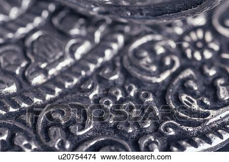 Close-up of a carved metal sheet View Large Photo Image Picture - Close-up of a carved metal sheet. Fotosearch