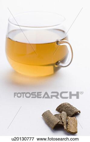 Stock Photo - Close-up of a cup of herbal tea with cinnamon. Fotosearch