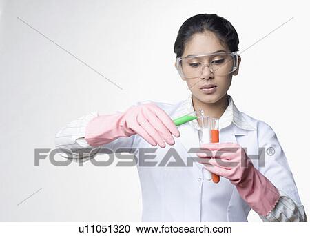 Close-up of a female lab technician holding test tubes View Large Photo Image Stock Image - Close-up of a female lab technician holding test tubes. Fotosearch