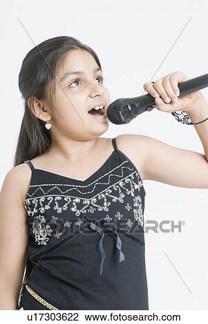 Close-up of a girl singing View Large Photo Image Stock Image - Close-up of a girl singing. Fotosearch