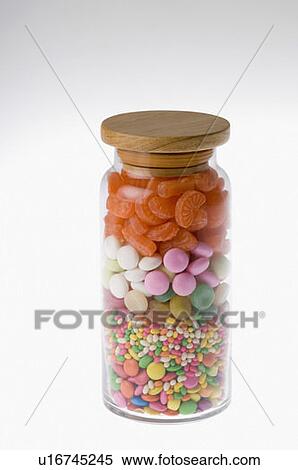 Stock Photography - Close-up of a jar of various candies. Fotosearch