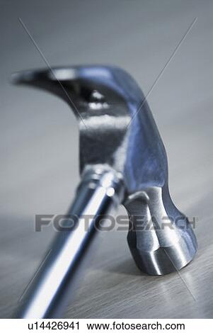 Stock Image - Close-up of a metallic hammer. Fotosearch