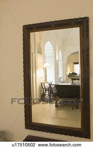 Close-up of a mirror mounted on a wall View Large Photo Image Stock Image - Close-up of a mirror mounted on a wall. Fotosearch