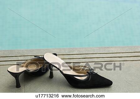 Close-up of a pair of black sandals View Large Photo Image Stock Photograph - Close-up of a pair of black sandals. Fotosearch