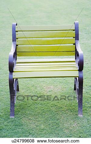 Close-up of a park bench in a park View Large Photo Image Stock Photo - Close-up of a park bench in a park. Fotosearch