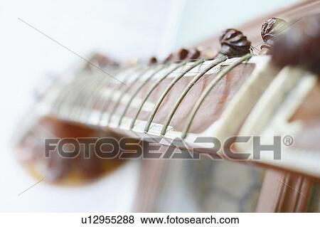 Close-up of a sitar View Large Photo Image Stock Photo - Close-up of a sitar. Fotosearch