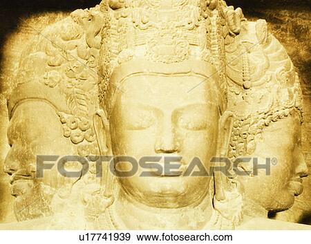 Stock Photo - Close-up of a statue in a cave, Elephanta Caves, Mumbai, Maharashtra, India. Fotosearch
