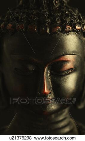 Close-up of a statue of Buddha View Large Photo Image Stock Photo - Close-up of a statue of Buddha. Fotosearch