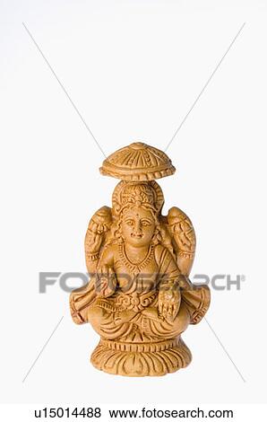Stock Photo - Close-up of a statue of Goddess Lakshmi. Fotosearch