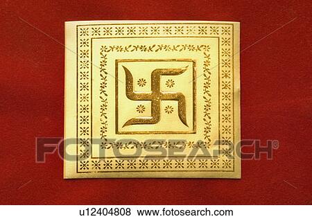 Stock Photo - Close-up of a swastika on a wedding invitation card. Fotosearch