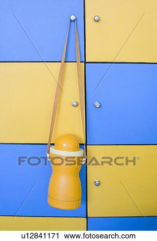 Stock Image - Close-up of a thermos hanging on an almirah. Fotosearch