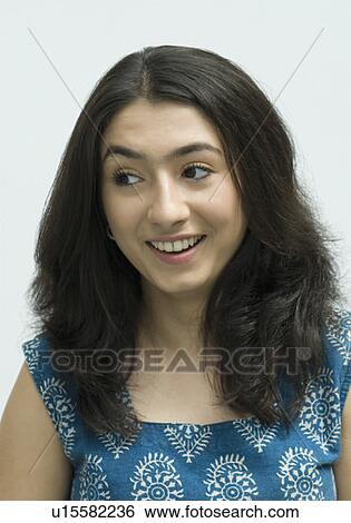 Close-up of a young woman smiling View Large Photo Image Stock Photograph - Close-up of a young woman smiling. Fotosearch