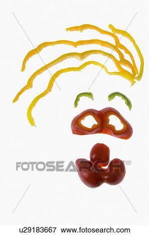 Stock Photo - Close-up of bell pepper slices representing a human face. Fotosearch
