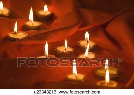 Close-up of burning oil lamps View Large Photo Image Stock Image - Close-up of burning oil lamps. Fotosearch