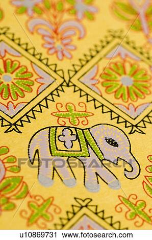 Stock Image - Close-up of designs on a wedding invitation card. Fotosearch
