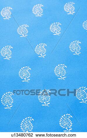 Stock Image - Close-up of designs on a wedding invitation card. Fotosearch