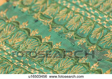 Close-up of embroidery on a fabric View Large Photo Image Stock Photograph - Close-up of embroidery on a fabric. Fotosearch