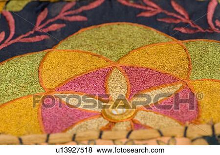 Stock Photo - Close-up of floral patterned embroidery on a fabric. Fotosearch