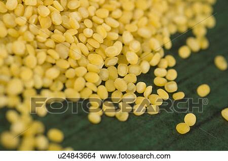Picture - Close-up of fried Split Green grams. Fotosearch