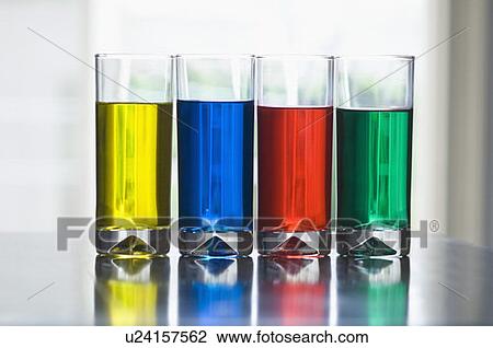 Stock Image - Close-up of glasses of multi-colored drinks. Fotosearch