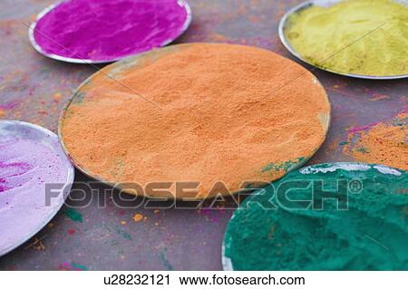 Stock Image - Close-up of powder paint in plates. Fotosearch
