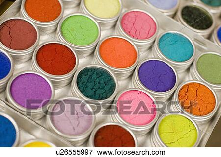 Stock Photo - Close-up of power paints in containers. Fotosearch