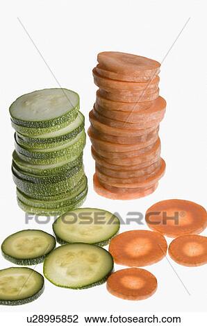 Close-up of stacks of carrot and cucumber slices View Large Photo Image Stock Image - Close-up of stacks of carrot and cucumber slices. Fotosearch
