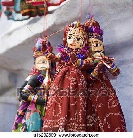 Close-up of three puppets hanging on strings, Pushkar, Rajasthan, India View Large Photo Image Stock Photo - Close-up of three puppets hanging on strings, Pushkar, Rajasthan, India. Fotosearch