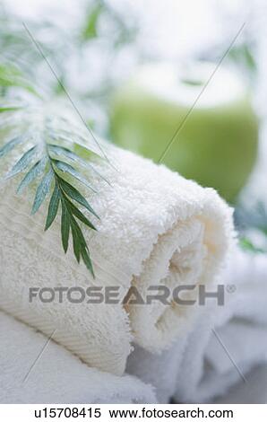 Stock Photography - Close-up of towels with an apple. Fotosearch