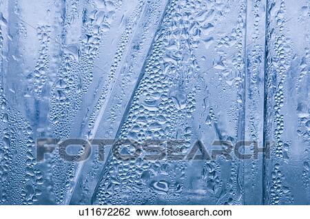 Close-up of water droplets on a bottle surface View Large Photo Image Stock Image - Close-up of water droplets on a bottle surface. Fotosearch