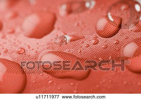 Close-up of water droplets on the surface View Large Photo Image Stock Photo - Close-up of water droplets on the surface. Fotosearch