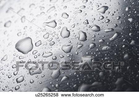 Close-up of water droplets on the surface View Large Photo Image Stock Photo - Close-up of water droplets on the surface. Fotosearch