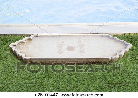 Stock Photo - Decorative structure at the poolside. Fotosearch