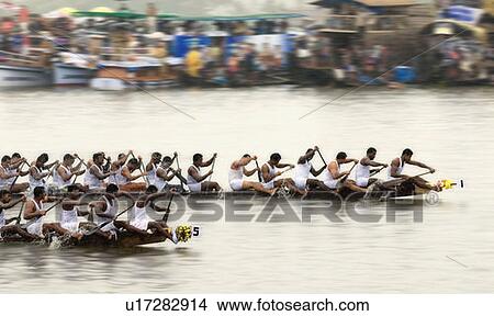 Group of people participating in a snake boat racing, Kerala, India View Large Photo Image Picture - Group of people participating in a snake boat racing, Kerala, India. Fotosearch