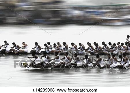 Stock Photo - Group of people participating in a snake boat racing, Kerala, India. Fotosearch