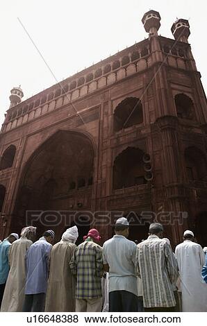Stock Photo - Group of people praying in a mosque. Fotosearch