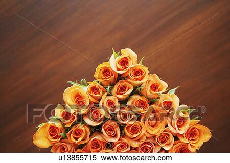 Stock Photography - High angle view of a bunch of roses on the table. Fotosearch