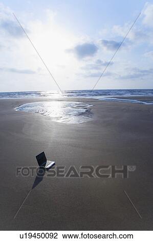 High angle view of a laptop on the beach View Large Photo Image Stock Image - High angle view of a laptop on the beach. Fotosearch