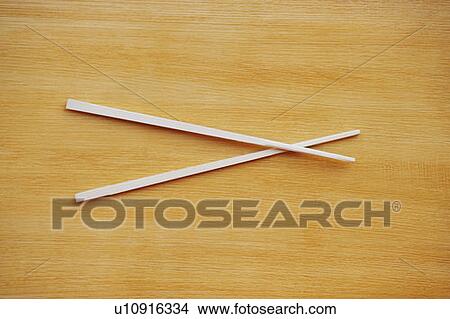 Picture - High angle view of a pair of chopsticks. Fotosearch