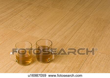 Stock Photo - High angle view of cups of herbal tea. Fotosearch