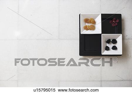 Stock Photography - High angle view of dried fruits in a tray. Fotosearch
