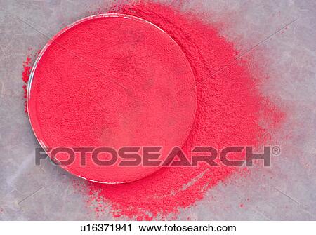 Stock Image - High angle view of powder paint in a plate. Fotosearch