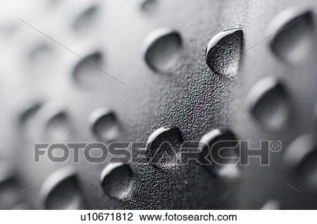 High angle view of water droplets on a black surface View Large Photo Image Stock Image - High angle view of water droplets on a black surface. Fotosearch