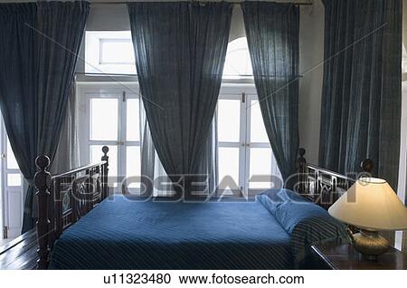 Stock Image - Interiors of a bedroom. Fotosearch