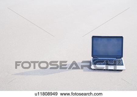 Stock Photo - Laptop on the beach. Fotosearch