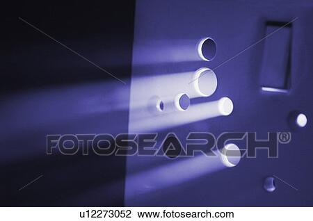 Stock Image - Light beam coming out from a socket. Fotosearch